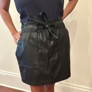 Black Faux Leather Skirt with Bow by [Brand]